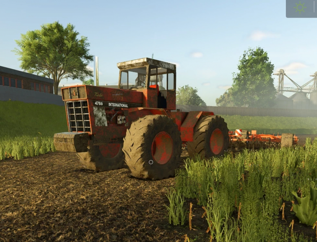 Vintage International Series 1486 tractor mod in FS25 on a farm field.