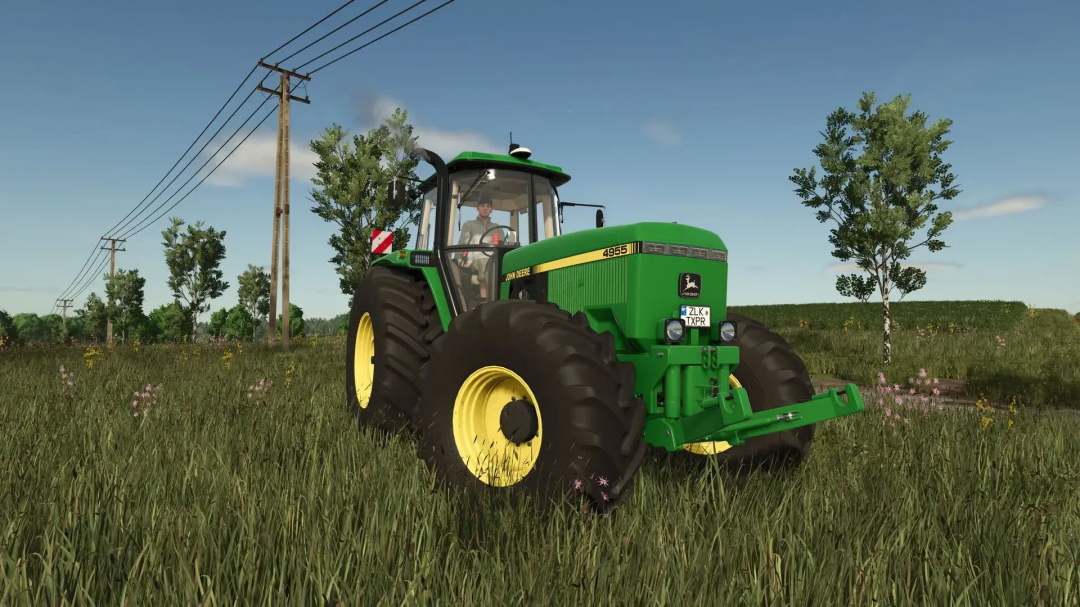 John Deere 4955 tractor mod in a grassy field, featured in Farming Simulator 25.