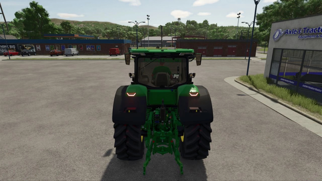 Rear view of John Deere 8R Series 2022 tractor mod in Farming Simulator 25, parked in a lot.