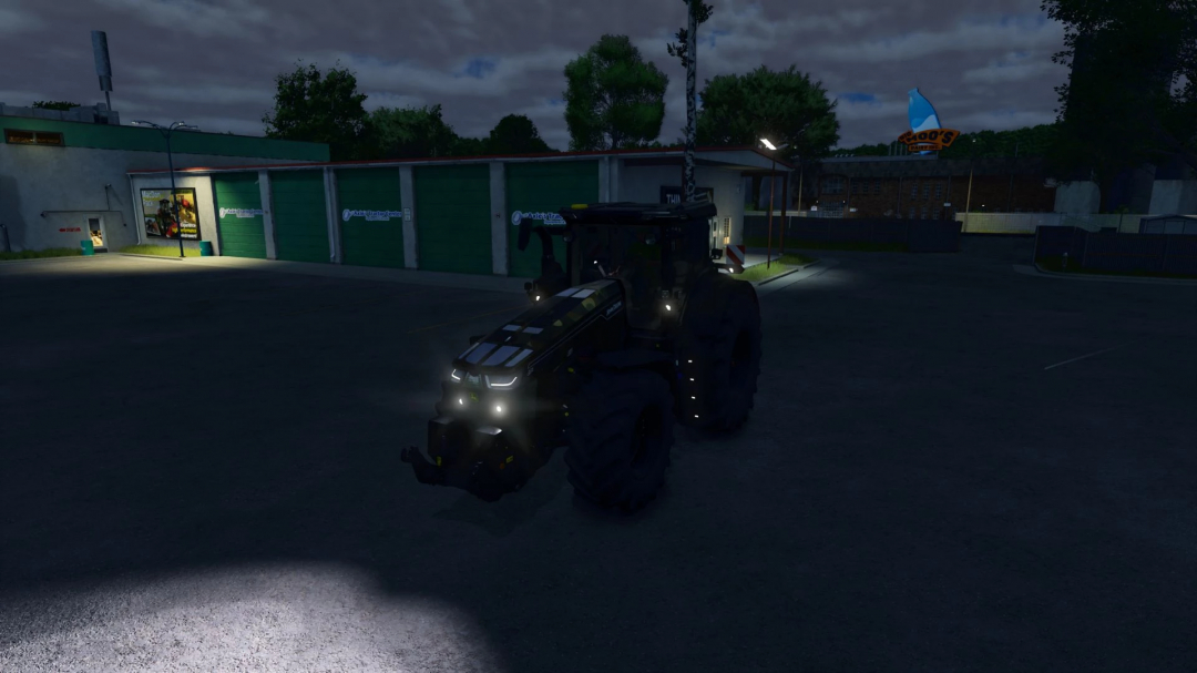 John Deere 8R Series 2022 Special Edition tractor at night in FS25 mod. The headlights illuminate the garage surroundings.