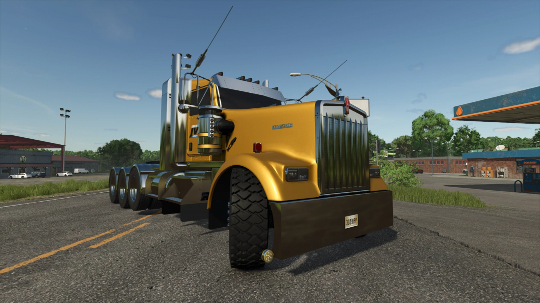 Kenworth W900L truck mod in FS25, parked beside a gas station under a clear sky.