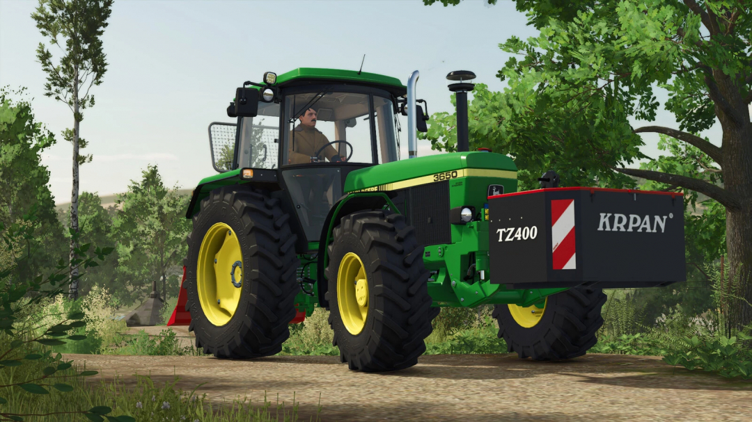 FS25 mod Krpan TZ400 v1.0.0.0 features a green tractor in a woodland setting.