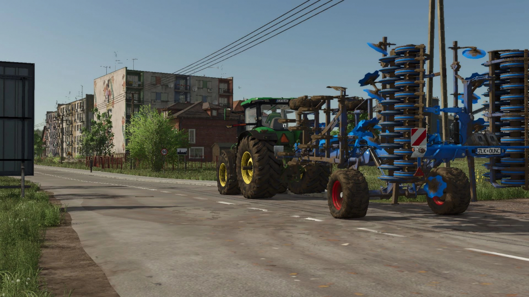 FS25 mod Lemken Karat 12 attached to a tractor on a city street in Farming Simulator 25.