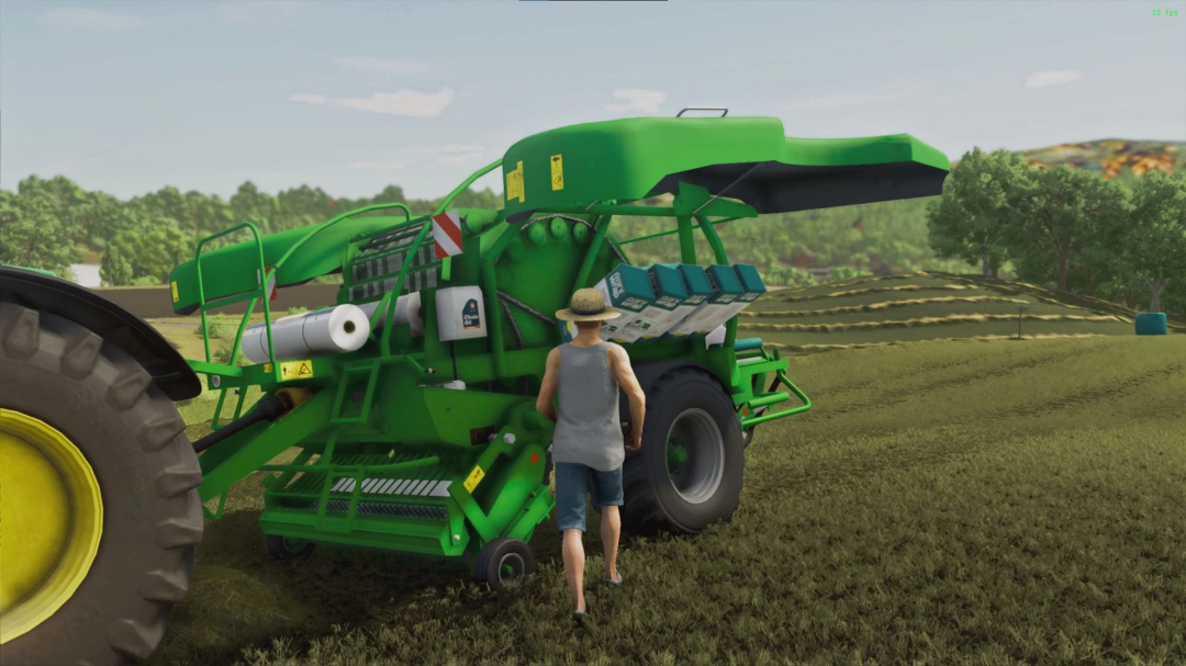 Farmer using McHale Fusion 4 mod in FS25, preparing hay bales in the field.