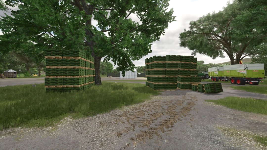 Stacks of green pallets and bales next to farm trailers in FS25 mod More pallets and bales v1.0.0.0 environment.