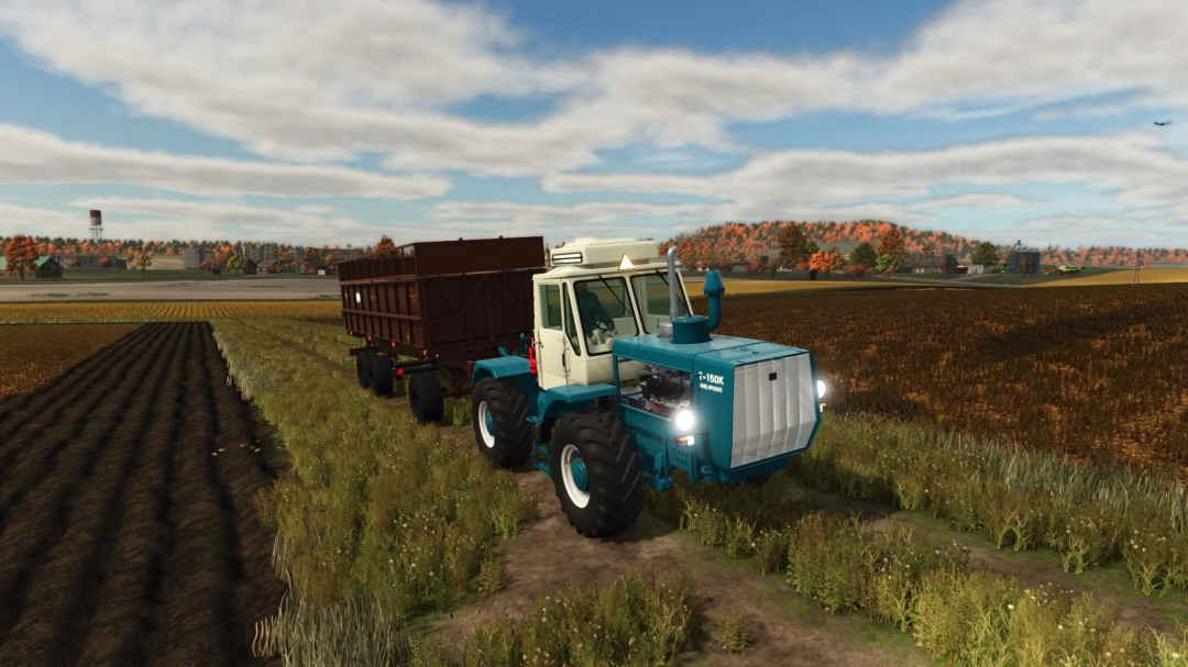 FS25 mod PTSB-12/17 v1.0.0.0 showing a tractor with a trailer on a farm field.