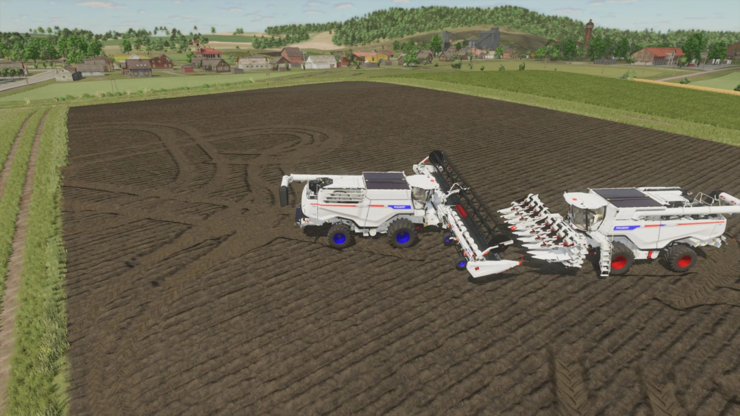 FS25 mod Philibert GXX780 v1.0.0.0 in a field, showing detailed farming equipment on fertile soil.