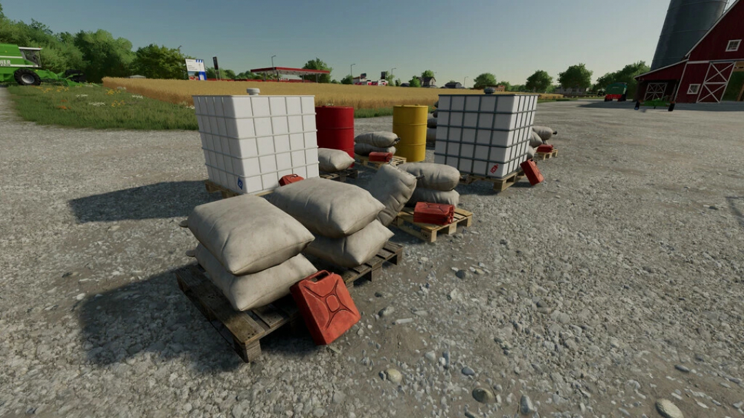 FS22 mods Placeable Filling Stations v1.1.0.0 showcasing pallets with containers and drums in a farm setting.