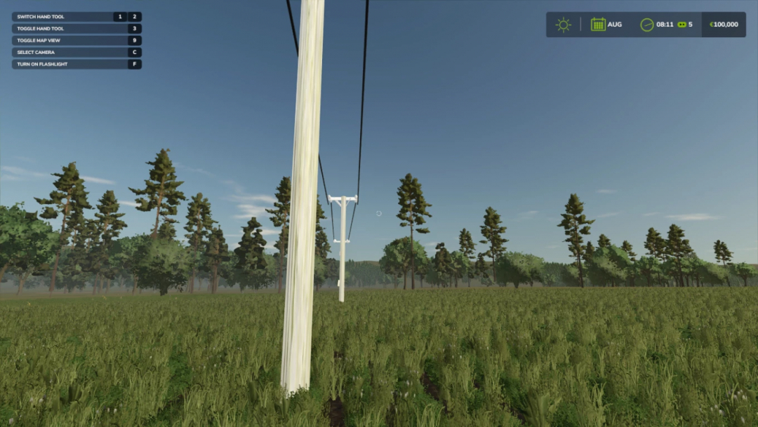 Image of Power prefab in Farming Simulator 25 mod, showing power lines crossing a field against a forest backdrop.