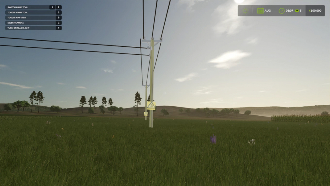 Power lines and poles in a grassy field, featured in FS25 mod Power prefab full release v1.0.0.0.