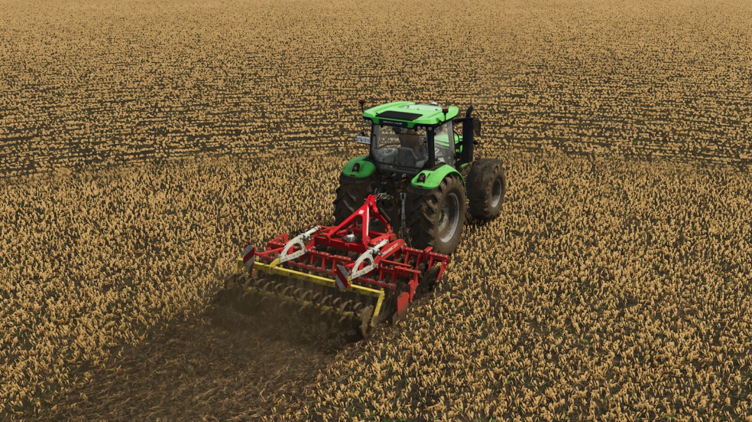 A tractor using the Pöttinger Terradisc 3001 mod on a field in FS25.