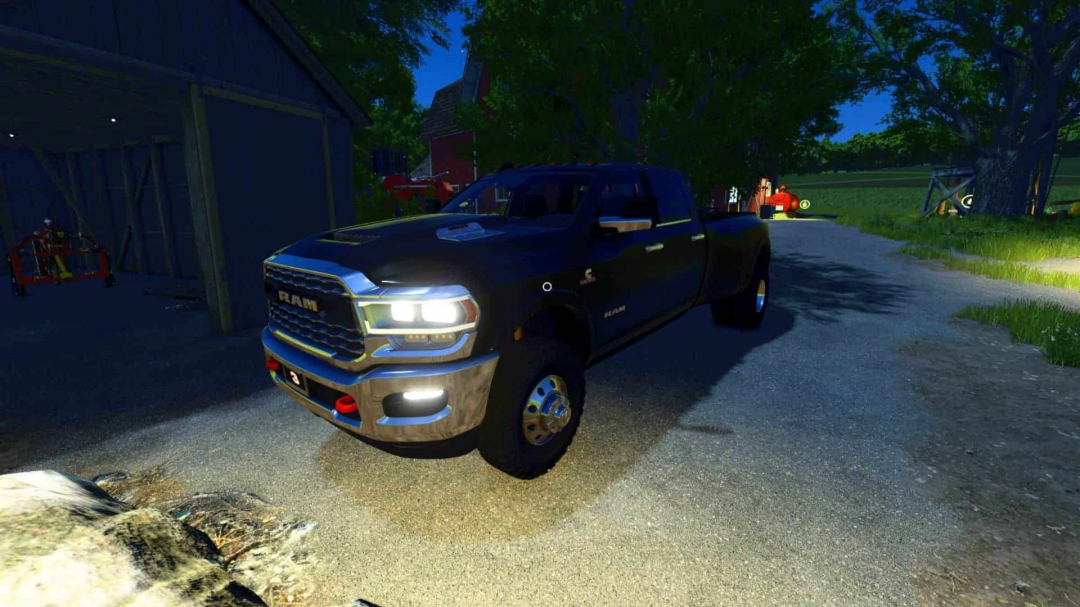 FS25 mod Ram 3500 Crew Cab parked outside a barn at night in Farming Simulator 25.