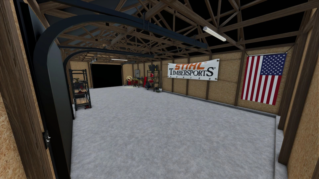 Interior view of a small garage workshop mod for FS25, featuring tools and banners on the walls.