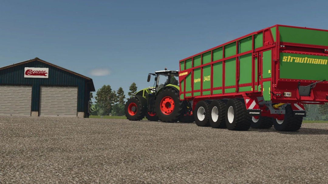 Strautman Aperion 7300 mod in FS25, featuring a green and red trailer with a tractor beside a barn.