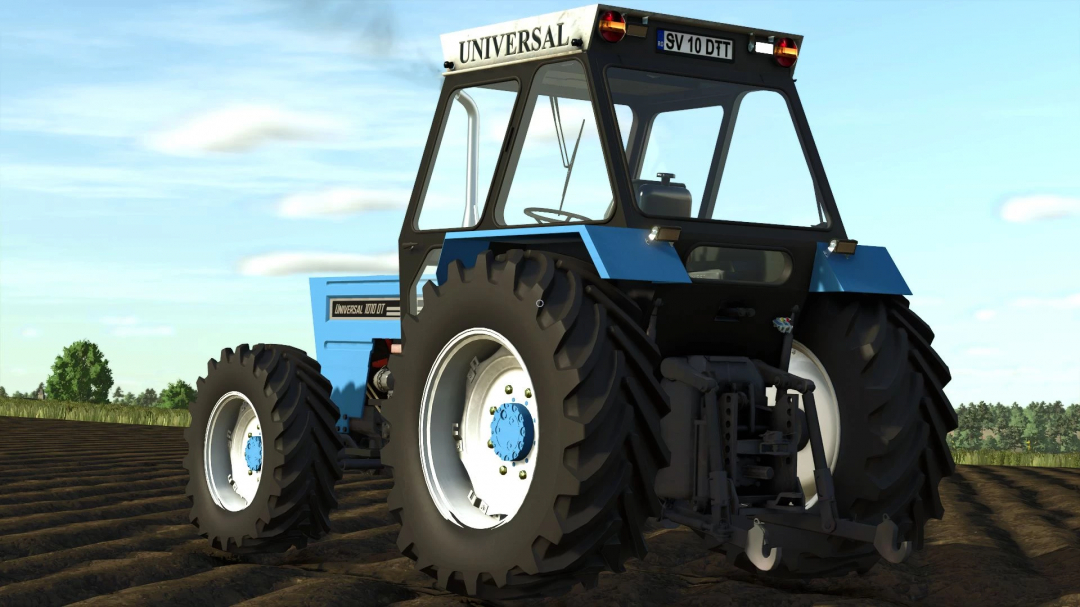 Universal 1010DT tractor mod in Farming Simulator 25 on a field. FS25 mods enhance gameplay with realistic vehicles.