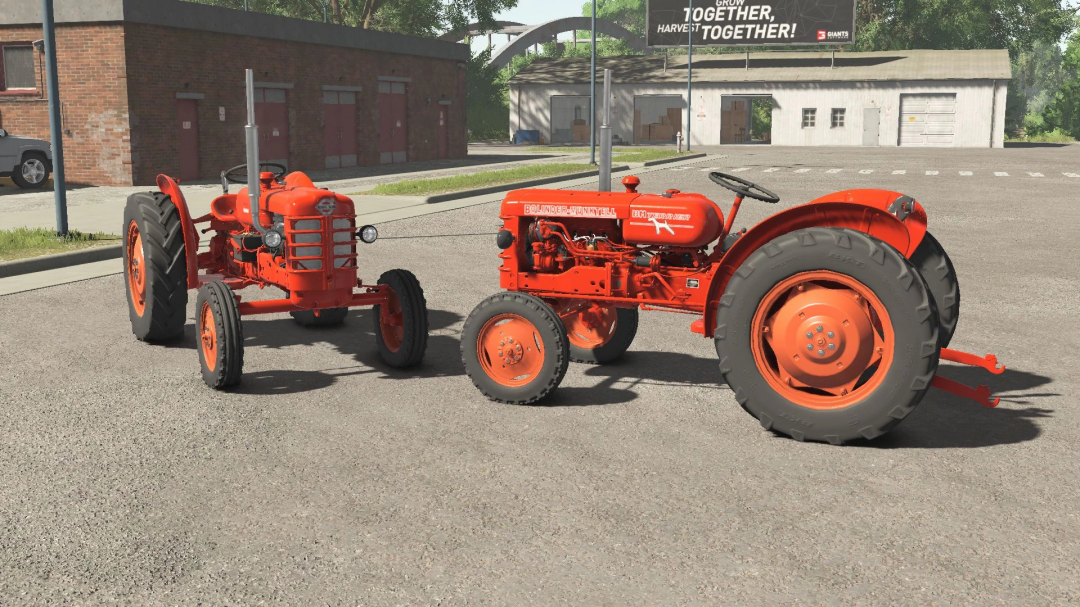 Two classic red tractors in Farming Simulator 25 Volvo T425 mod, enhancing vintage farming experience.