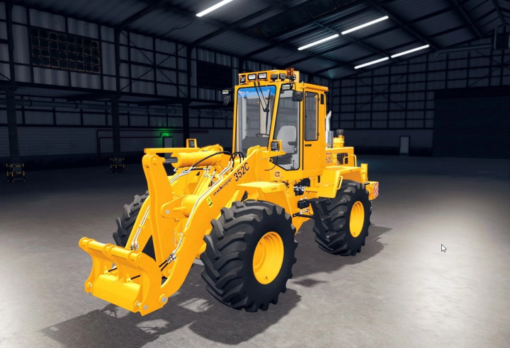 fs25-mods, Amkodor 352C loader mod in FS25 depicted inside a large garage.