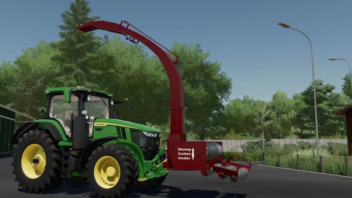 fs25-mods,  FS25 mod Bruks All In One v1.0.0.0 showing a green tractor with a red stump cutter attachment in a rural setting.