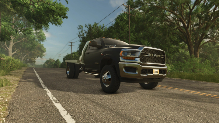 fs25-mods,  Dodge Ram 5500 mod v1.1.0.0 for Farming Simulator 25, driving down a rural road surrounded by trees.