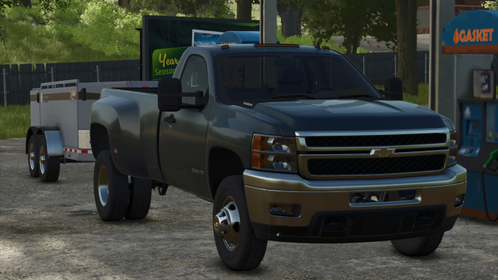 fs25-mods,  FS25 mod showcasing a 2010 Chevy 3500 Dually v1.0.0.0 parked by a gas pump in Farming Simulator 25.