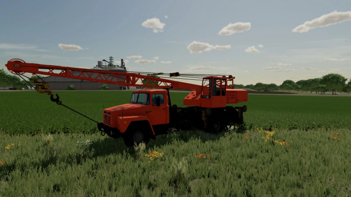 fs22-mods, FS22 mod KrAZ 250 KS4561 crane in a field in Farming Simulator 22.