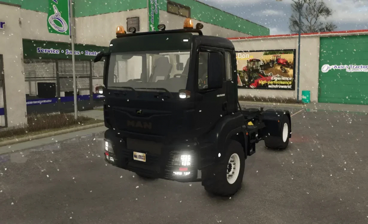 fs25-mods,  FS25 mod MAN TGS 18500 v1.0.0.3 truck in snowy environment outside a dealership.