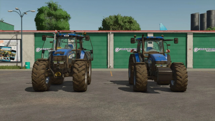 fs25-mods,  Two blue New Holland TM tractors in FS25 mod pack parked in a lot.