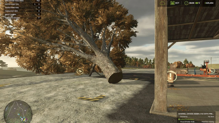 fs25-mods, Farming Simulator 25 Sawmill LT15 mod showing a large felled tree next to a sawmill with PrefabWall, enhancing gameplay realism.