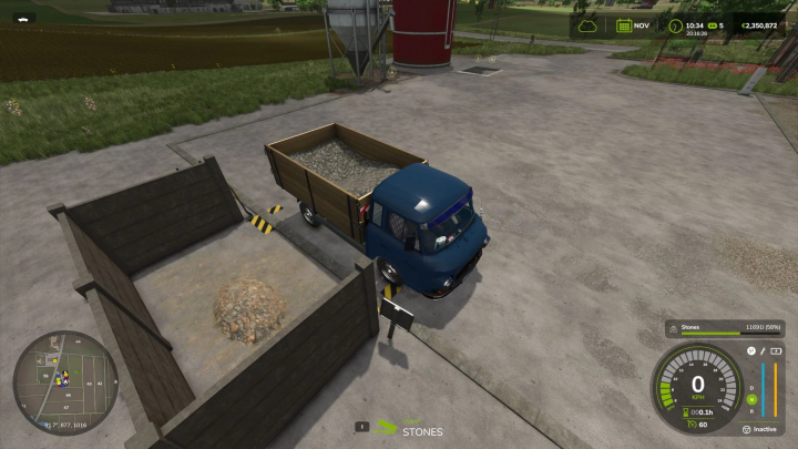 fs25-mods,  FS25 mod: Small Handmade Stone Silo with truck unloading stones in Farming Simulator 25.