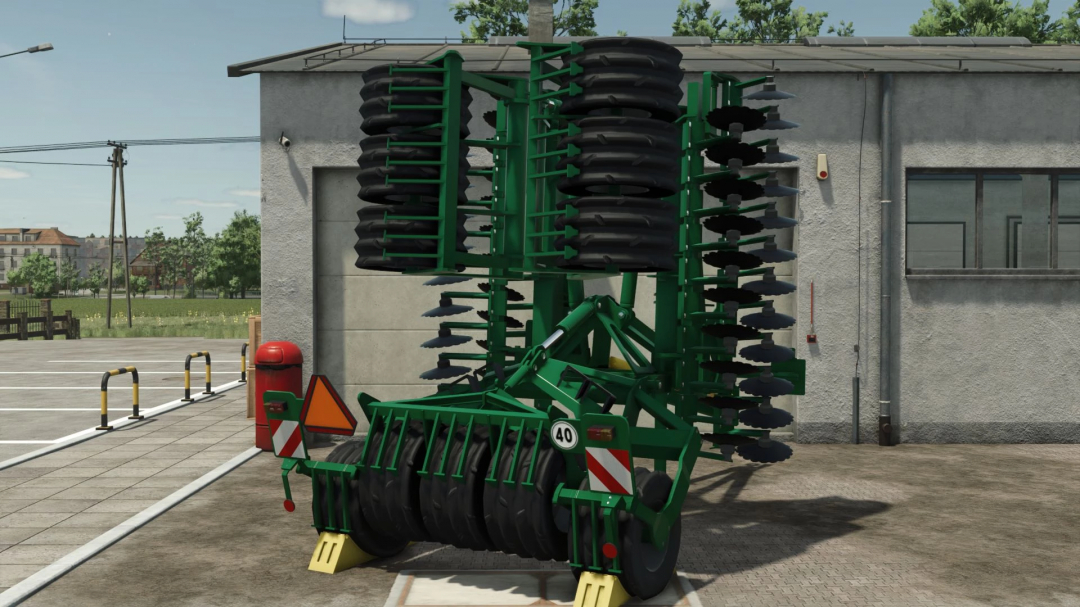 Amazone Catros 5501 mod for FS25, showcasing a green disc harrow against a workshop backdrop.