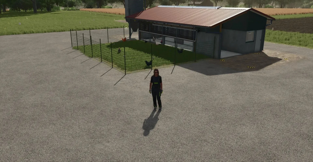 FS25 mod BigChickenBarn v1.0.0.0 showing a large chicken barn with fenced area and character in Farming Simulator 25.