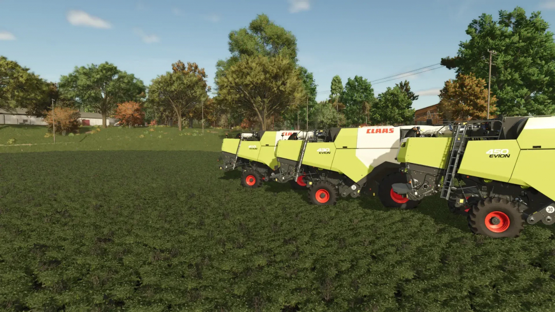 Claas Evion Pack in Farming Simulator 25, showcasing three green harvesters on a farm field.