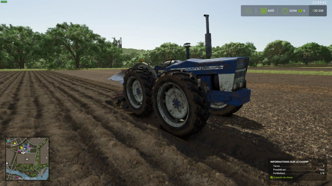 FS25 mod County 1124 v1.0.0.1 tractor on a plowed field in Farming Simulator 25.