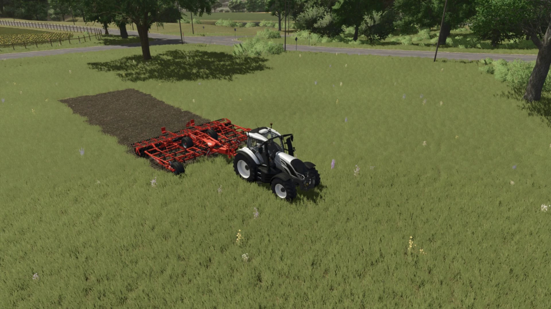 FS25 mod CultiPlow v1.0.0.0 in action, tractor plowing a grassy field.