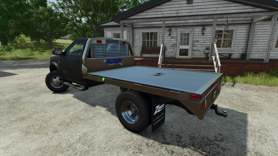 Dodge Ram 5500 mod v1.1.0.0 for FS25 with a flatbed trailer, parked in front of a rustic house.