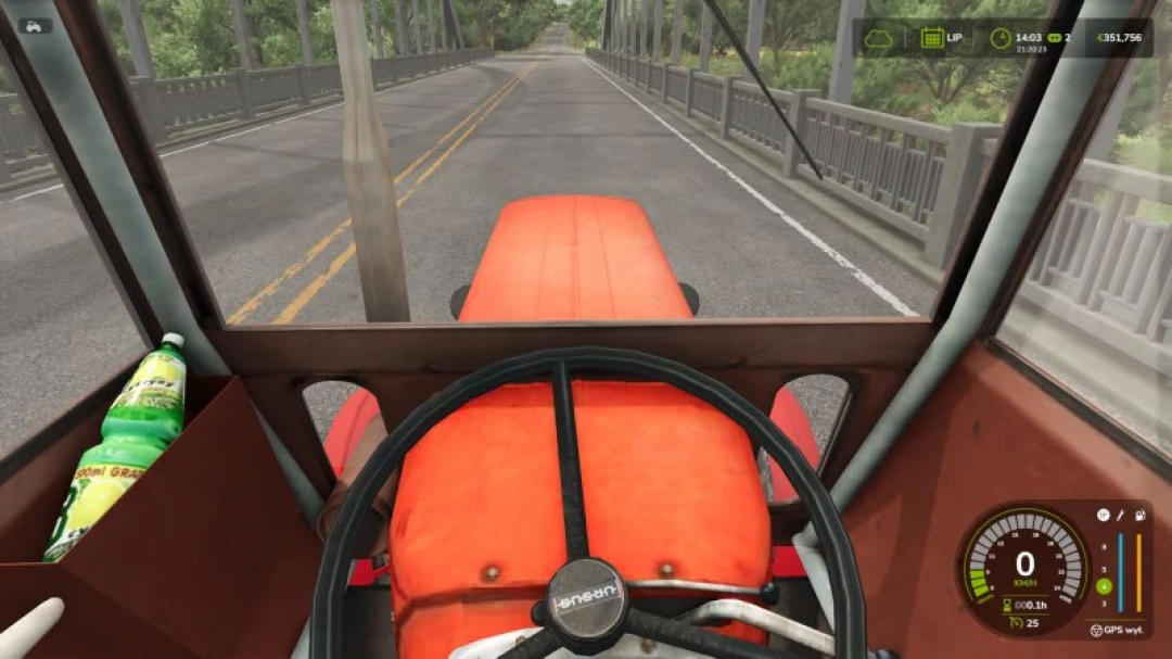 FS25 mods: View from inside Ursus c 360 tractor mod in Farming Simulator 25, driving on a bridge.