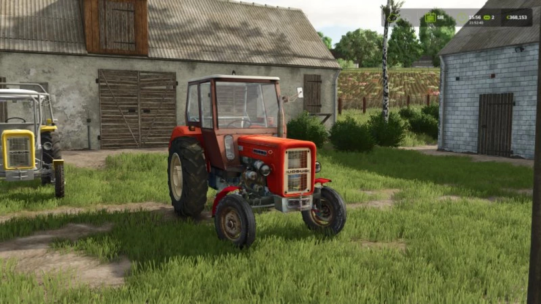 FS25 Ursus c 360 red tractor mod parked on a farm in Farming Simulator 25.