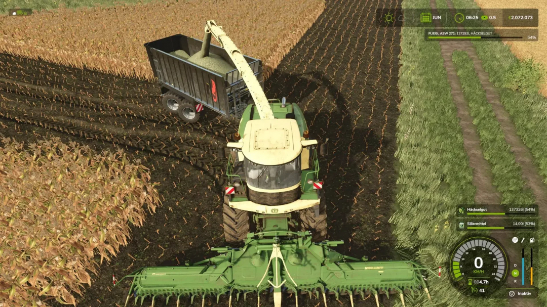 FS25 mod Fliegl ASW 271 trailer collecting crops with a harvester in Farming Simulator 25.