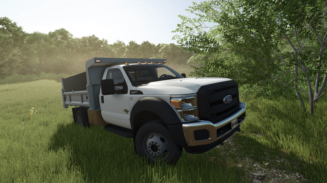 Ford F550 Dump Truck mod in Farming Simulator 25, parked on grass with trees in the background.