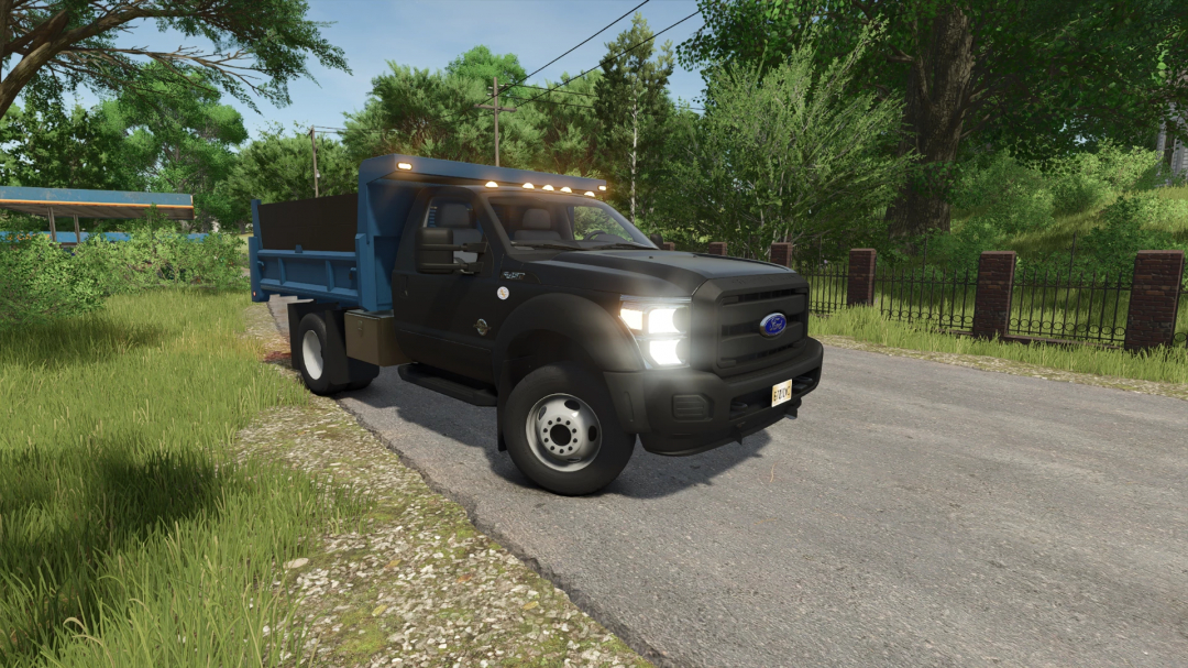 Ford F550 Dump Truck mod for FS25 parked on a rural road with greenery.