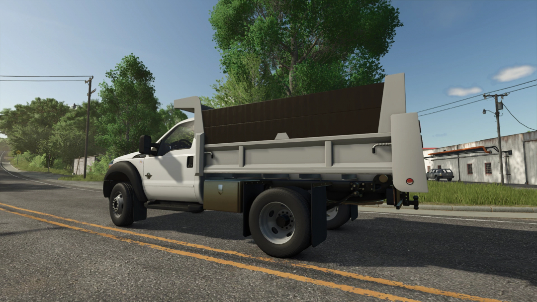 Ford F550 Dump Truck mod for FS25 parked on a rural road.