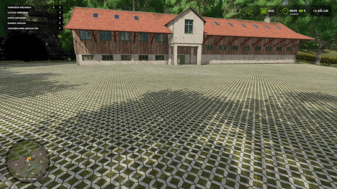 A rustic barn with a red roof in FS25 HermannsEck mod, surrounded by a detailed grid-patterned courtyard.