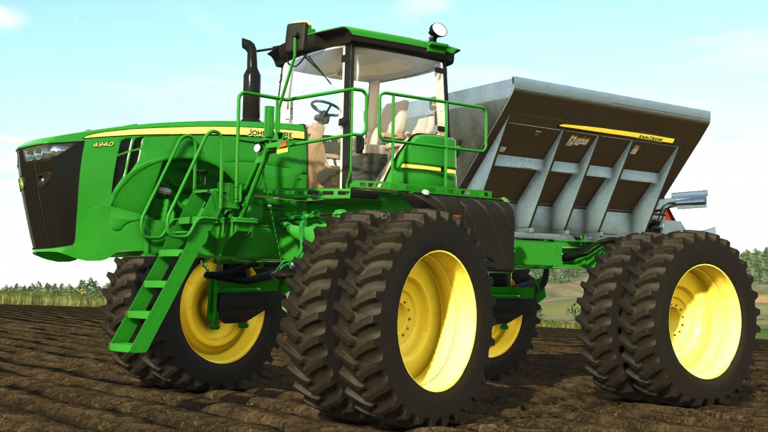 John Deere 4940 mod in FS25 showcasing a green spreader on a plowed field.