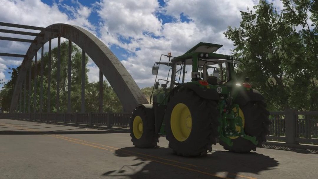 John Deere 6x20 Series tractor mod crossing a bridge in FS25. Enhances Farming Simulator 25 with realistic farm equipment.