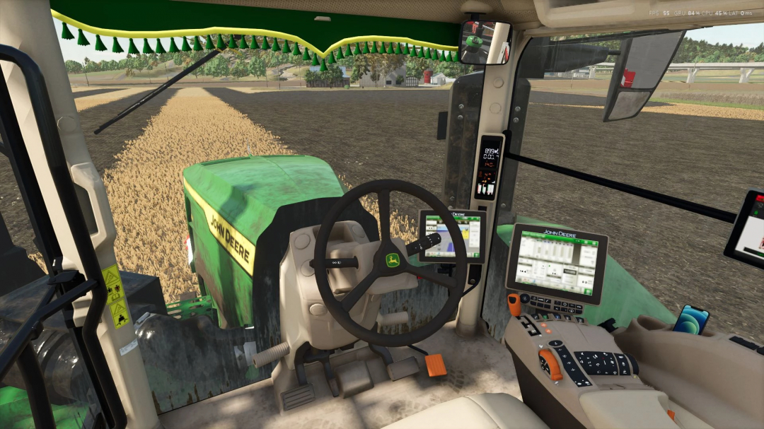 Interior view of John Deere 9R/X Series tractor mod in FS25, showing detailed controls and display screens.