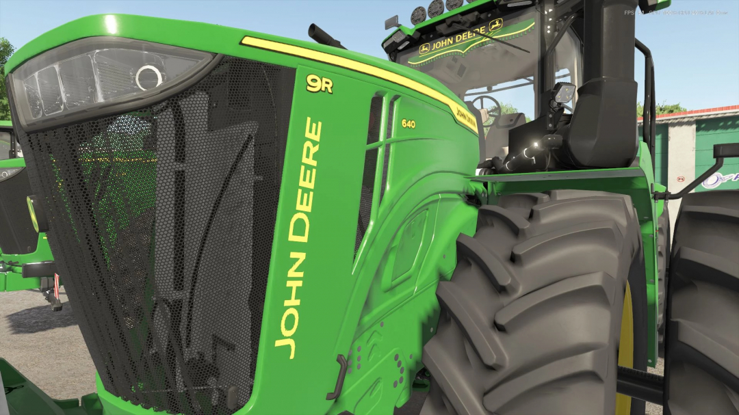 Close-up of John Deere 9R tractor mod for Farming Simulator 25, showcasing its detailed design. FS25 mods enhance gameplay.