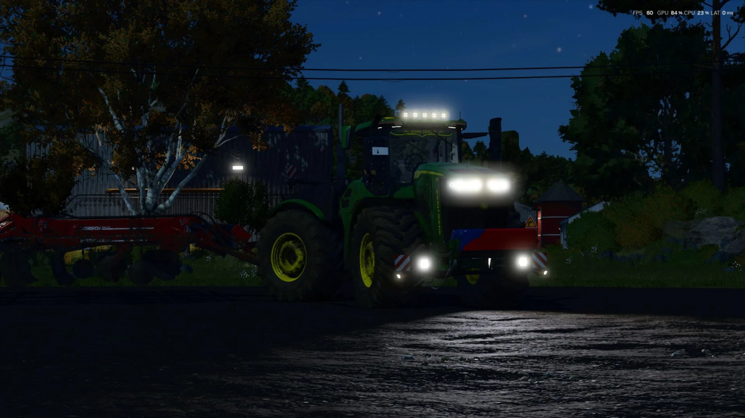 Night view of John Deere 9R/X Series tractor mod in FS25, showcasing lights and design enhancements.