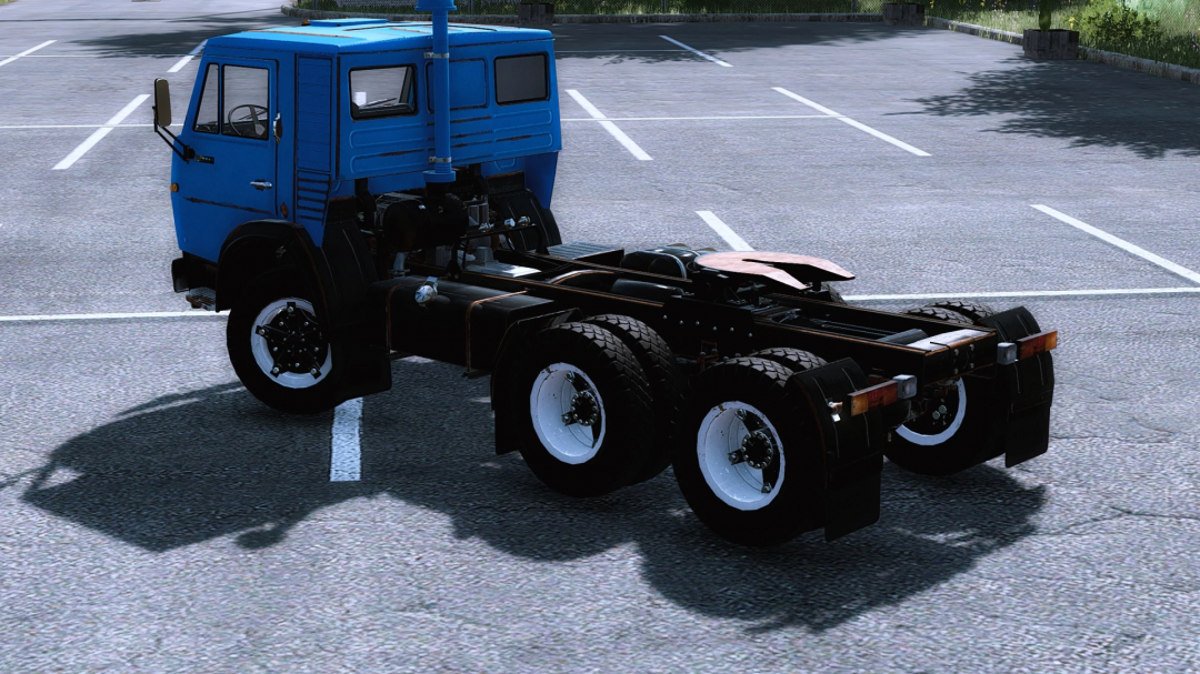 Kamaz 54112 semi v1.0.0.0 FS22 mod showcasing a blue truck chassis in a parking lot.