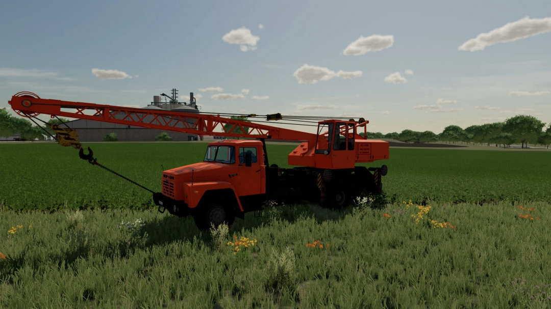 FS22 mod KrAZ 250 KS4561 crane in a field in Farming Simulator 22.