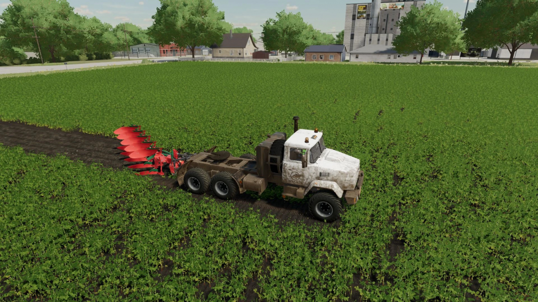 FS22 mod Kraz 6322 truck plowing a field in Farming Simulator 22.